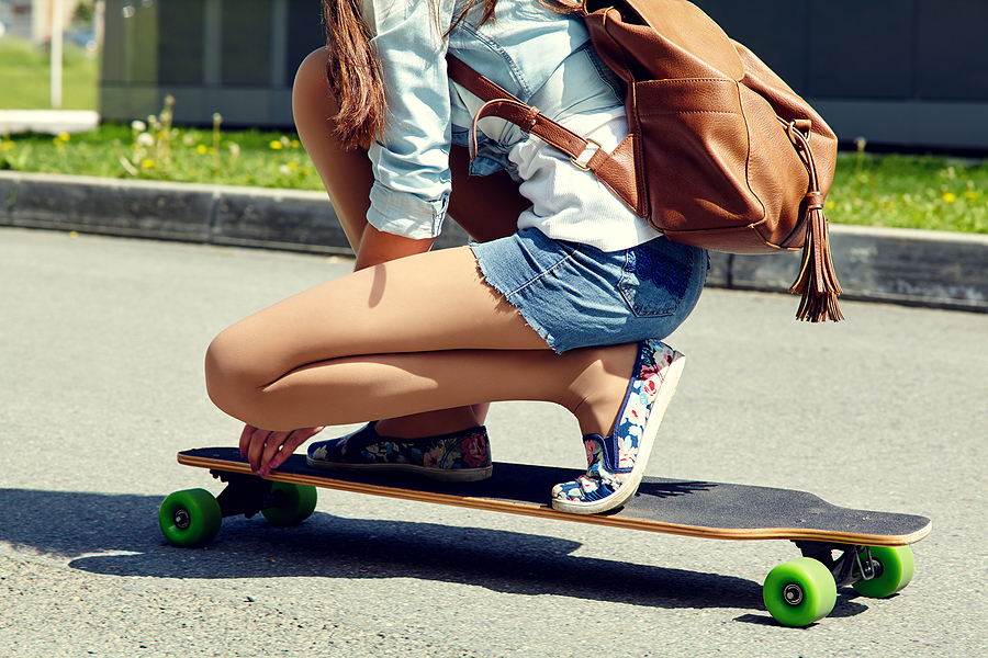 Woman trying out a skateboard